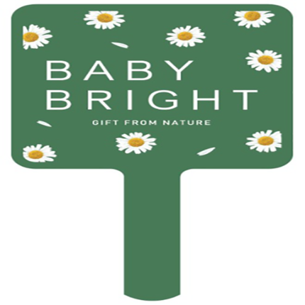 a green sign with white text and flowers